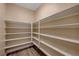 Walk-in pantry with wooden floors and plenty of shelving storage for all your kitchen needs at 12122 High Country Ln, Las Vegas, NV 89138