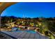 Elevated view of a backyard oasis, featuring a sparkling pool, relaxing spa, and beautifully landscaped gardens at 12122 High Country Ln, Las Vegas, NV 89138