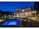 Inviting pool and spa with a covered patio and outdoor kitchen, creating a resort-like backyard oasis at 12122 High Country Ln, Las Vegas, NV 89138
