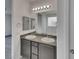 Bathroom with double sinks, granite countertops, and bright lighting, creating a welcoming space at 138 Scarlett View Ave, North Las Vegas, NV 89031