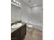 Bright bathroom features granite counters, new white fixtures, and tile floors at 138 Scarlett View Ave, North Las Vegas, NV 89031