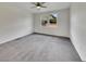 Spacious bedroom with neutral walls, gray carpeting, and a bright window view at 138 Scarlett View Ave, North Las Vegas, NV 89031