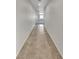 Long hallway features tile floors and access to bedrooms and main living area at 138 Scarlett View Ave, North Las Vegas, NV 89031