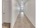 Long hallway features tile floors and access to bedrooms and main living area at 138 Scarlett View Ave, North Las Vegas, NV 89031