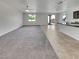 Open-concept living space featuring gray carpet and tile flooring, perfect for modern living at 138 Scarlett View Ave, North Las Vegas, NV 89031