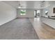 Bright living area with tile flooring, neutral carpet, ceiling fan, and windows offering ample natural light at 138 Scarlett View Ave, North Las Vegas, NV 89031