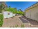 This backyard boasts desert landscaping and a storage shed for all your outdoor needs at 1508 Ten Palms Ct, Las Vegas, NV 89117