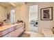 Elegant bathroom with a granite-topped vanity and a view into the bedroom at 1508 Ten Palms Ct, Las Vegas, NV 89117