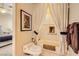 Bright bathroom featuring a tub with tile surround and a privacy curtain at 1508 Ten Palms Ct, Las Vegas, NV 89117