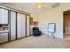 Neutral bedroom featuring a ceiling fan and a built-in wardrobe for ample storage at 1508 Ten Palms Ct, Las Vegas, NV 89117