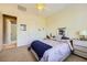 Bedroom featuring neutral walls and carpet, ceiling fan, and an ensuite bathroom at 1508 Ten Palms Ct, Las Vegas, NV 89117