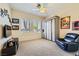 Comfortable bedroom featuring shuttered windows, a ceiling fan, and a built-in wardrobe for ample storage at 1508 Ten Palms Ct, Las Vegas, NV 89117