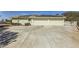 Wide driveway leading to the attached two-car garage of this home with solar panels at 1508 Ten Palms Ct, Las Vegas, NV 89117