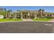 Well-maintained home with lush landscaping, mature palm trees, and circular driveway at 1508 Ten Palms Ct, Las Vegas, NV 89117