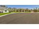 Well-maintained home with lush landscaping, mature palm trees, and circular driveway at 1508 Ten Palms Ct, Las Vegas, NV 89117