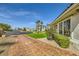 Property exterior featuring mature trees, attractive landscaping, and brick walkway to the home at 1508 Ten Palms Ct, Las Vegas, NV 89117
