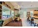 Kitchen and dining area featuring large windows, a ceiling fan, and backyard views at 1508 Ten Palms Ct, Las Vegas, NV 89117
