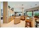 Expansive kitchen featuring an island with bar seating and plentiful natural light at 1508 Ten Palms Ct, Las Vegas, NV 89117