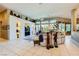 Spacious living room featuring tile floors, recessed lighting, and stylish decor at 1508 Ten Palms Ct, Las Vegas, NV 89117