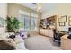 Home office with built-in bookshelves, lots of light, and a comfortable couch at 1508 Ten Palms Ct, Las Vegas, NV 89117