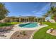 Backyard view featuring a sparkling private pool and landscaped patio area perfect for outdoor entertaining at 1508 Ten Palms Ct, Las Vegas, NV 89117