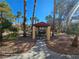 Community gazebo featuring a table and chairs nestled among mature trees, offering a serene spot to relax at 1830 N Buffalo Dr # 1091, Las Vegas, NV 89128