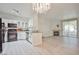View of kitchen appliances from living room with fireplace and sliding glass door to backyard at 1830 N Buffalo Dr # 1091, Las Vegas, NV 89128