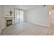 Bright, open living room features a fireplace, neutral paint, and sliding glass door to the outside at 1830 N Buffalo Dr # 1091, Las Vegas, NV 89128
