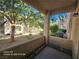 Cozy patio area with views of a green courtyard, perfect for relaxing and enjoying the outdoors at 1830 N Buffalo Dr # 1091, Las Vegas, NV 89128