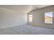 Spacious carpeted bedroom with natural light from two windows at 1890 Bova Matrina Ct, Las Vegas, NV 89123