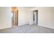 This bedroom features neutral paint, plush carpet, and an ensuite bathroom, creating a comfortable private retreat at 1890 Bova Matrina Ct, Las Vegas, NV 89123