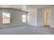 Carpeted bedroom with archway entrance to bathroom at 1890 Bova Matrina Ct, Las Vegas, NV 89123