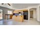 Bright kitchen with an island, wood cabinets, and modern appliances, perfect for cooking at 1890 Bova Matrina Ct, Las Vegas, NV 89123