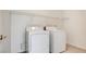 Laundry room featuring a dryer, washer and storage shelf at 1890 Bova Matrina Ct, Las Vegas, NV 89123