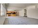 Expansive living area offers plush carpeting, natural light, and seamless transition to kitchen at 1890 Bova Matrina Ct, Las Vegas, NV 89123