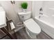Modern bathroom with sleek toilet, tiled shower-tub combination, and contemporary design at 2407 Ridgeline Wash St, Las Vegas, NV 89138