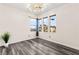 Bright bedroom with hardwood floors, recessed lighting, and three large windows with neighborhood views at 2407 Ridgeline Wash St, Las Vegas, NV 89138