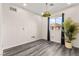 Bright bedroom with hardwood floors, modern lighting and a large window with stylish curtains at 2407 Ridgeline Wash St, Las Vegas, NV 89138