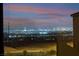Evening view of the city skyline from the property showing city lights in the distance at 2407 Ridgeline Wash St, Las Vegas, NV 89138