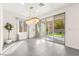 Dining room features modern light fixture and sliding glass door with access to the backyard at 2407 Ridgeline Wash St, Las Vegas, NV 89138