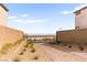 Private, gated driveway with desert landscaping and city views beyond at 2407 Ridgeline Wash St, Las Vegas, NV 89138