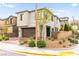 Well-maintained house with desert landscaping, brick driveway and mountain views in the background at 2407 Ridgeline Wash St, Las Vegas, NV 89138
