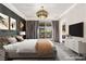 Relaxing main bedroom with balcony access, featuring neutral tones and stylish furnishings at 2407 Ridgeline Wash St, Las Vegas, NV 89138