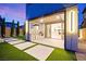 Charming covered patio with an outdoor kitchen and artificial turf at 2407 Ridgeline Wash St, Las Vegas, NV 89138