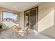 Cozy patio with stylish chairs and table for outdoor enjoyment at 2407 Ridgeline Wash St, Las Vegas, NV 89138