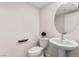 Tastefully designed powder room featuring decorative sink, fixtures, and toilet at 2407 Ridgeline Wash St, Las Vegas, NV 89138