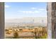 A stunning view of the Las Vegas skyline framed by a fence offers a glimpse of the vibrant city life at 2407 Ridgeline Wash St, Las Vegas, NV 89138