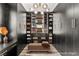 Organized walk-in closet with ample storage and shelving for shoes, bags, and folded clothes at 2407 Ridgeline Wash St, Las Vegas, NV 89138