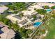 Stunning aerial view of a luxurious home with a pool, manicured landscaping, and a nearby golf course at 28 Painted Feather Way, Las Vegas, NV 89135