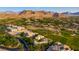 Scenic aerial view of the community, featuring beautiful homes nestled in a lush desert landscape at 28 Painted Feather Way, Las Vegas, NV 89135
